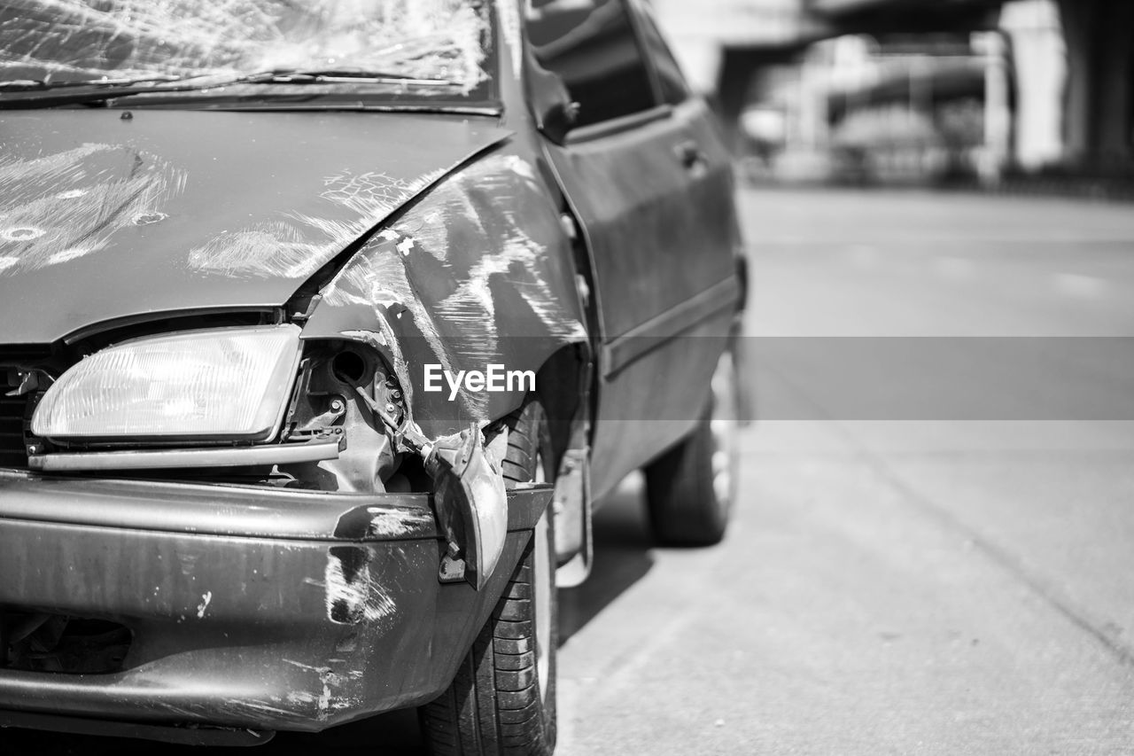 CLOSE-UP OF CAR ON ROAD