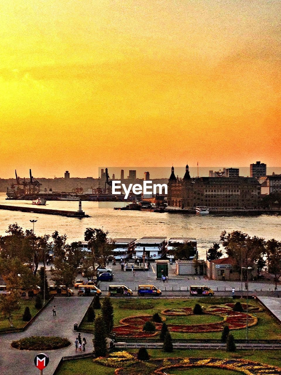 View of formal garden and marina at dusk