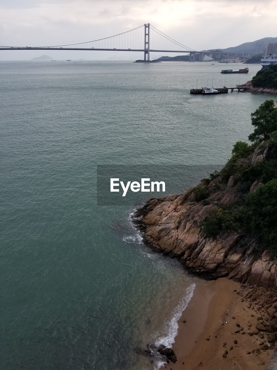 VIEW OF SUSPENSION BRIDGE AT SEA