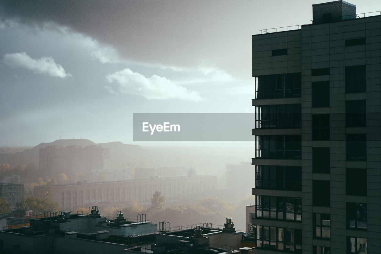 Buildings in city against sky