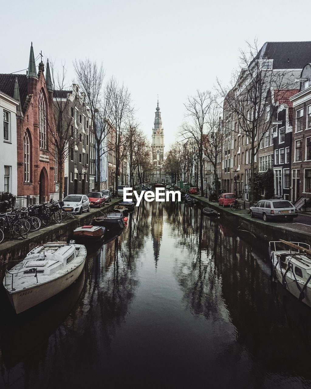 PANORAMIC VIEW OF BUILDINGS AND CANAL AGAINST SKY