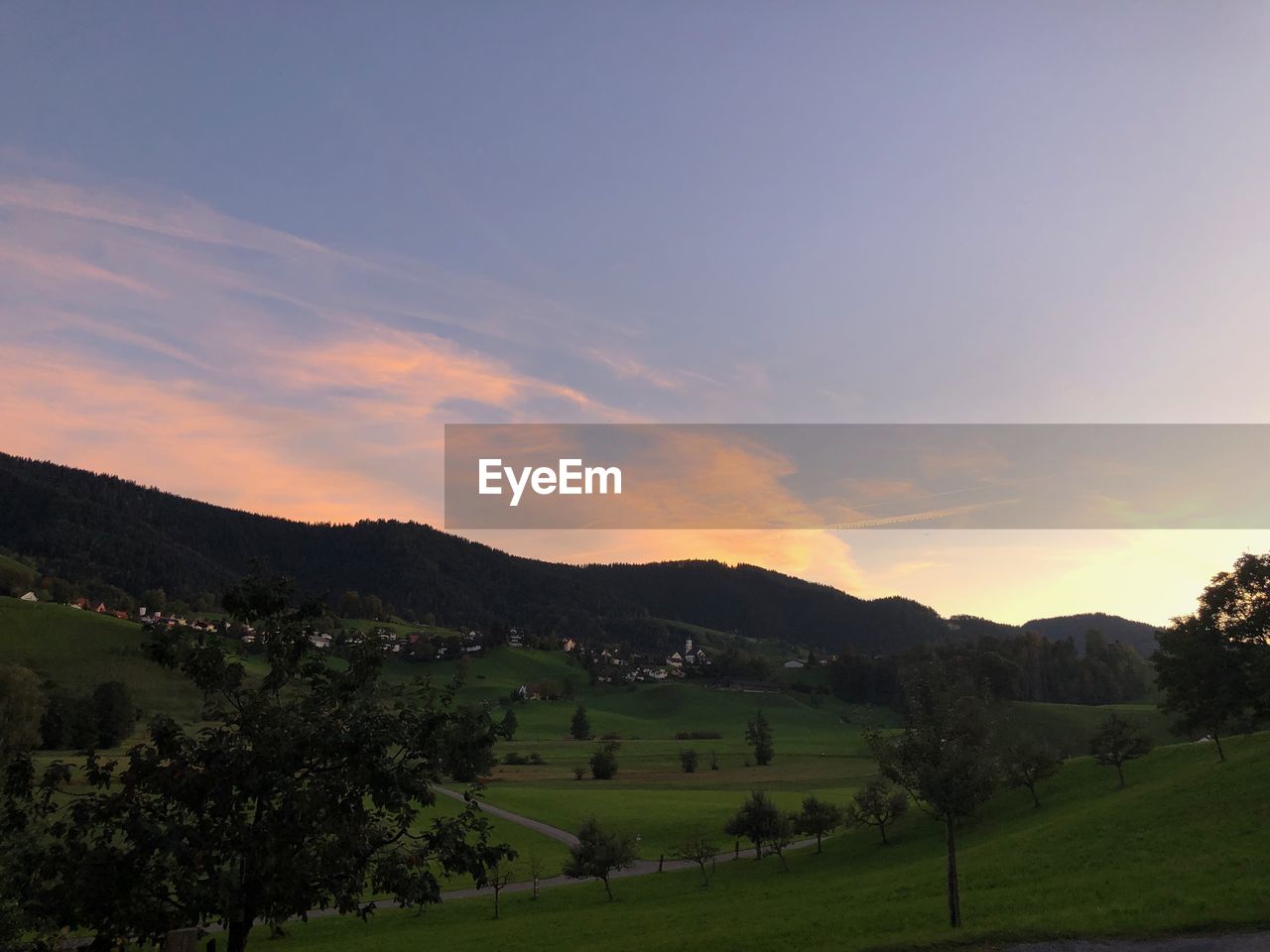 SCENIC VIEW OF LANDSCAPE AND MOUNTAINS AGAINST SKY