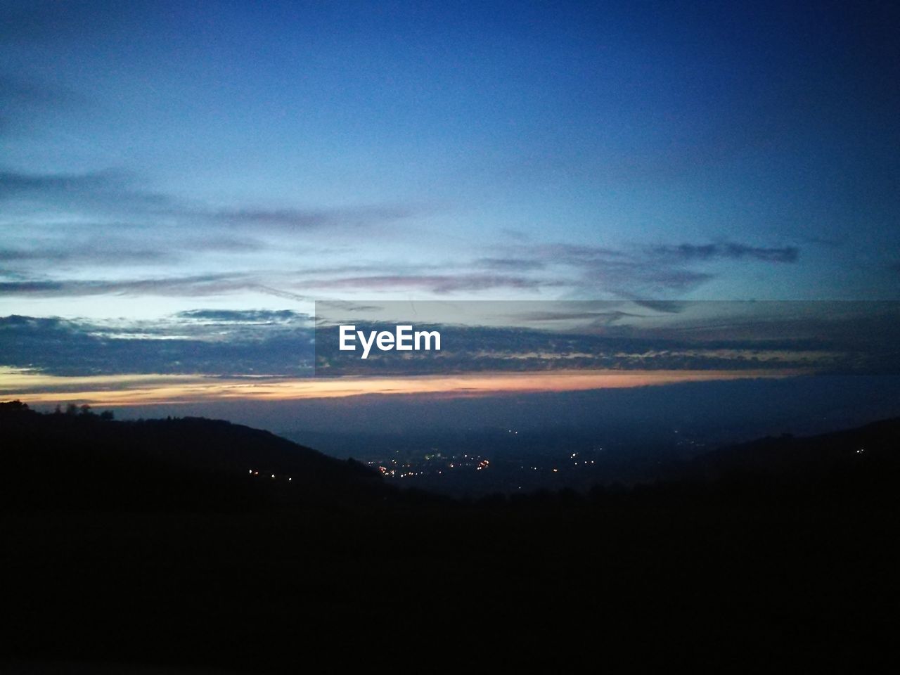 SCENIC VIEW OF DRAMATIC SKY AT SUNSET