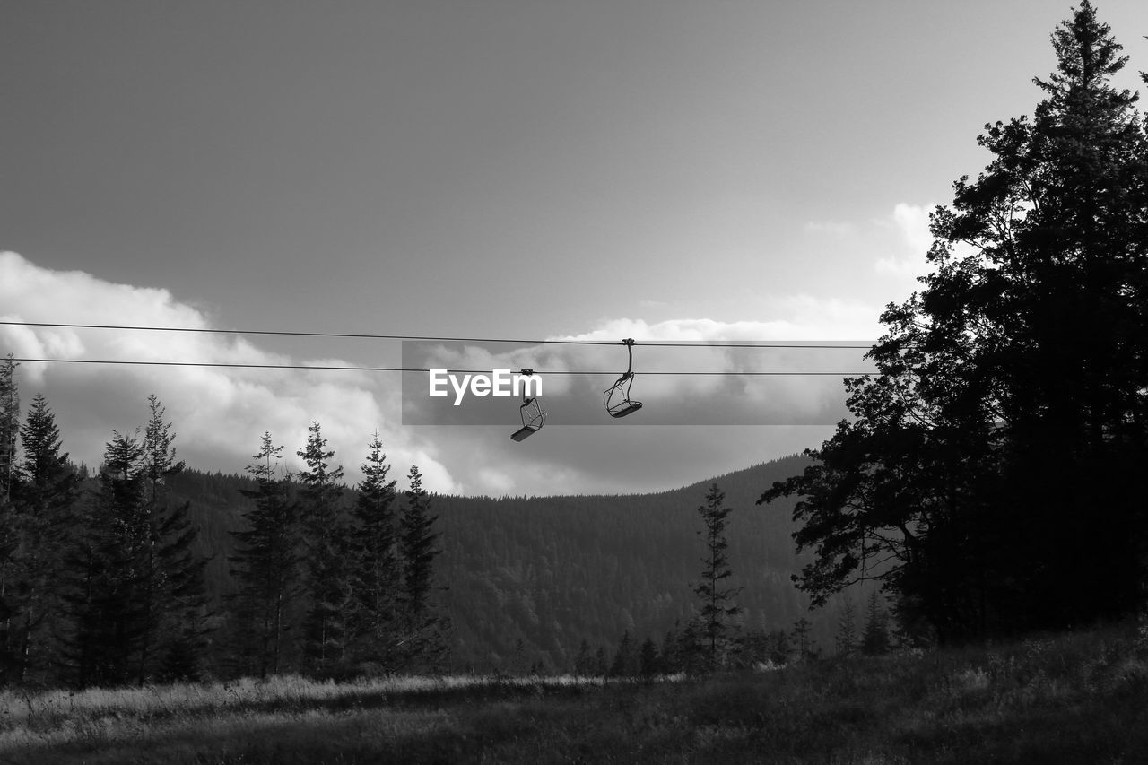 Low angle view of ski lift against sky