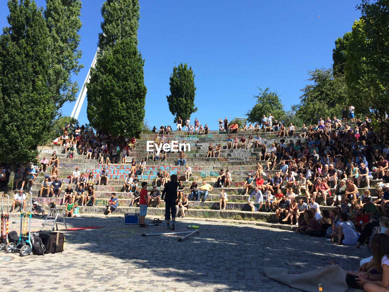 People in park against clear blue sky