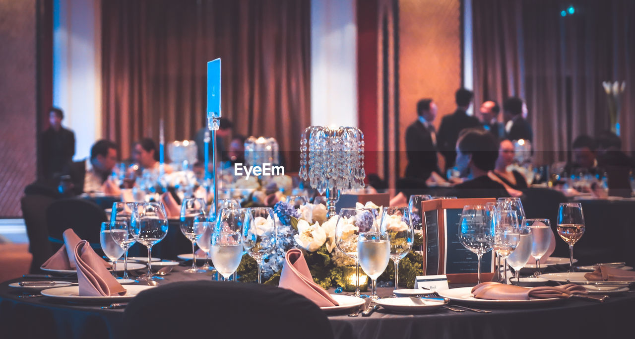 An elegant dining table set prepared for a gala dinner. luxury table setting in hotel.