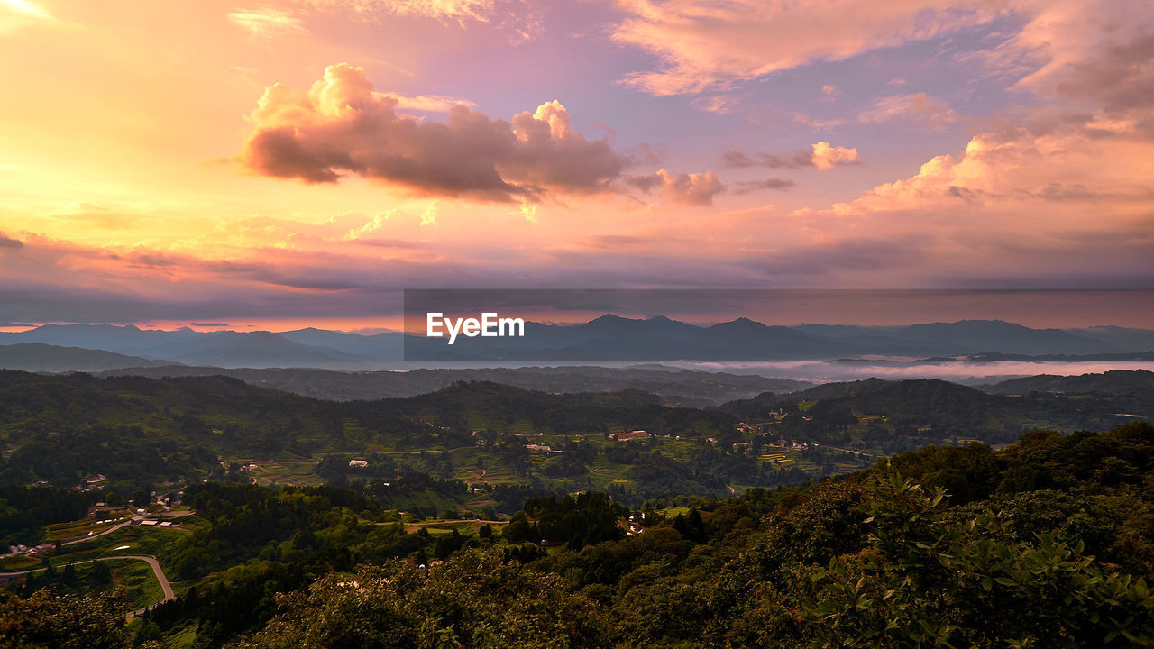 Scenic view of landscape against sky during sunset