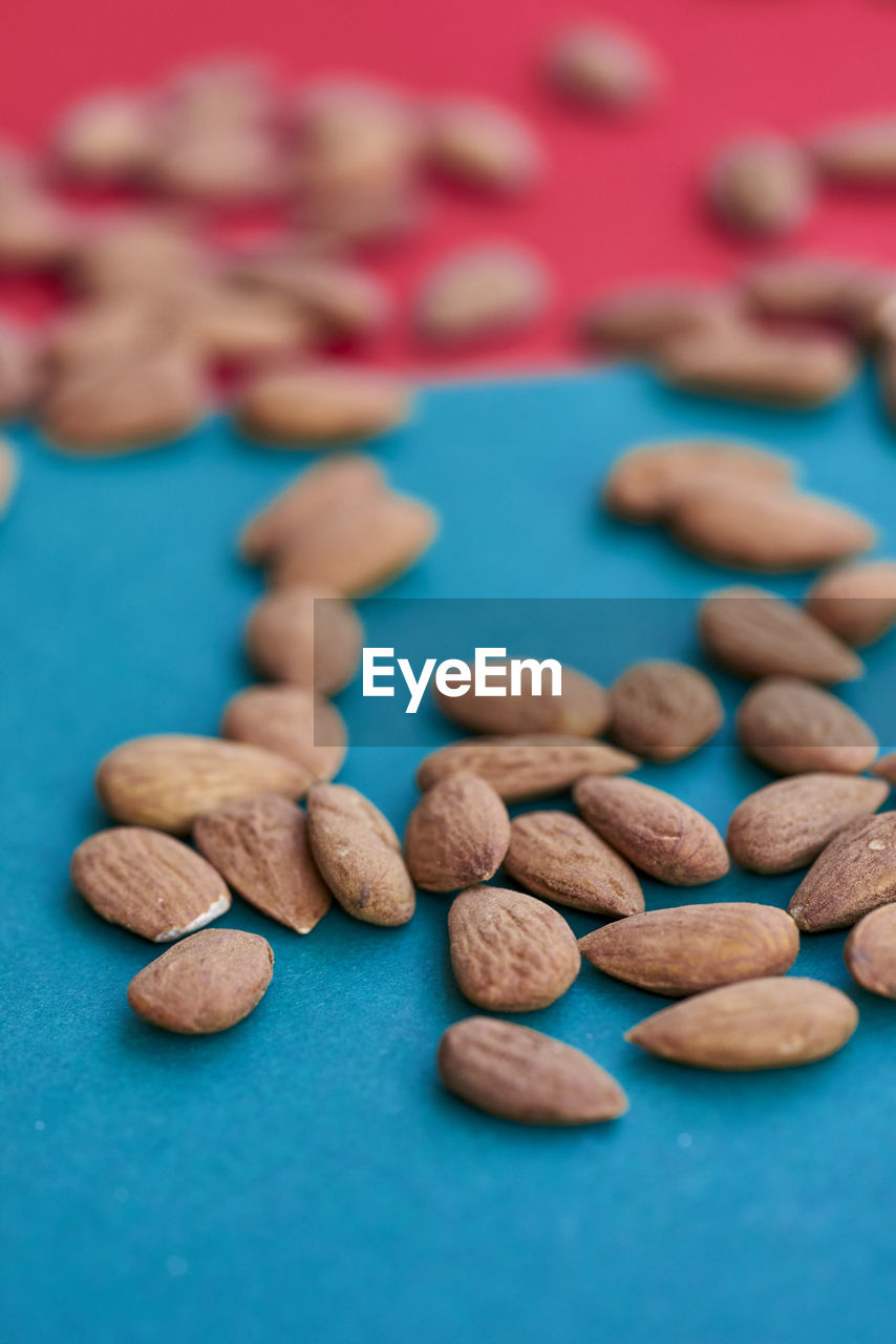 Close-up of almonds against two tone background