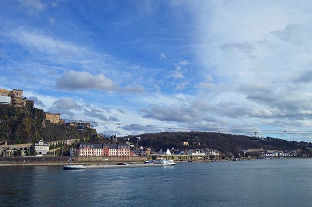 VIEW OF RIVER AGAINST CLOUDY SKY