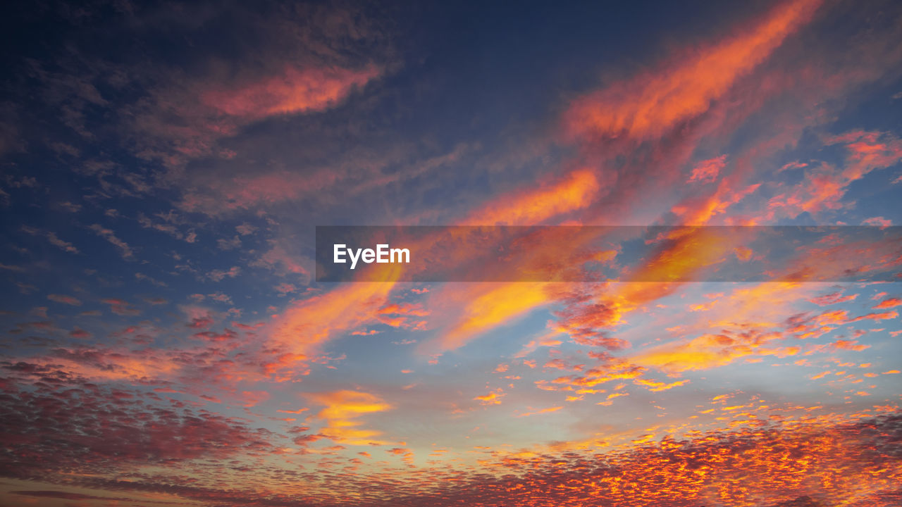 sky, cloud, afterglow, sunset, beauty in nature, red sky at morning, scenics - nature, dramatic sky, orange color, nature, dawn, horizon, evening, environment, tranquility, no people, multi colored, tranquil scene, landscape, outdoors, cloudscape, idyllic, red, sunlight, awe, land, backgrounds, vibrant color