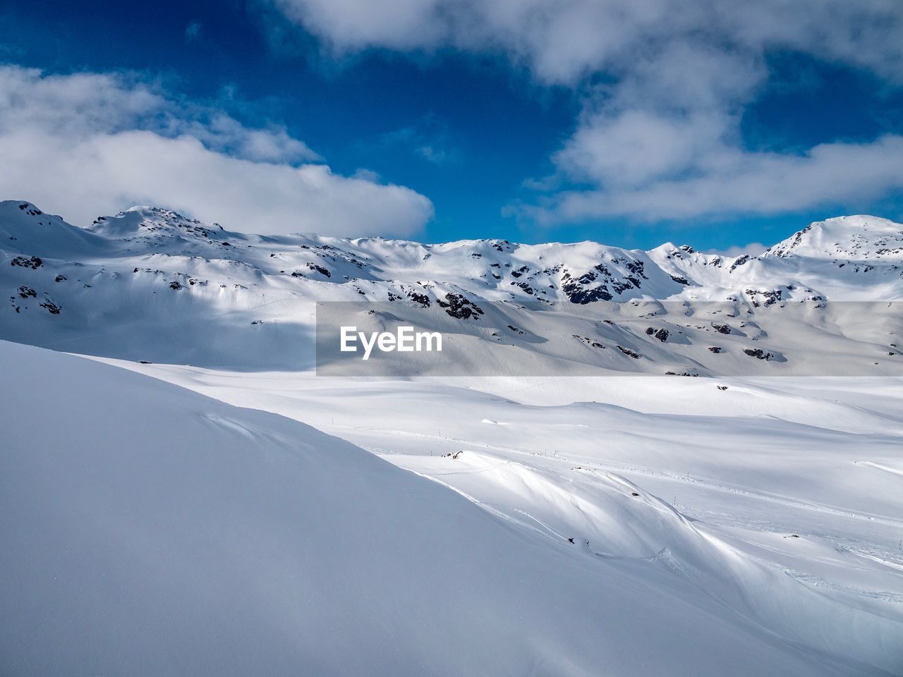 Scenic view of snowcapped mountains against sky