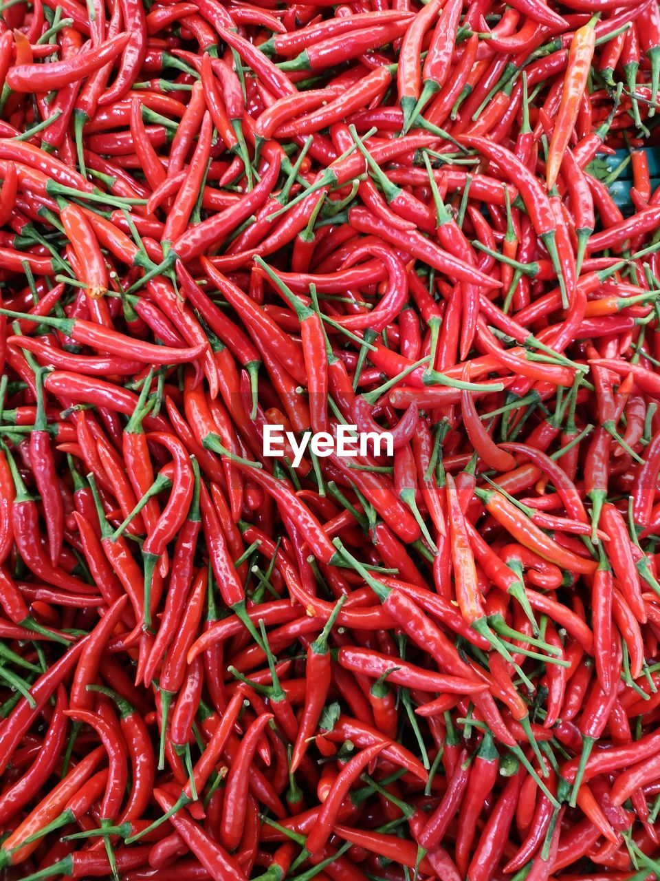 Full frame shot of red chili peppers for sale at market