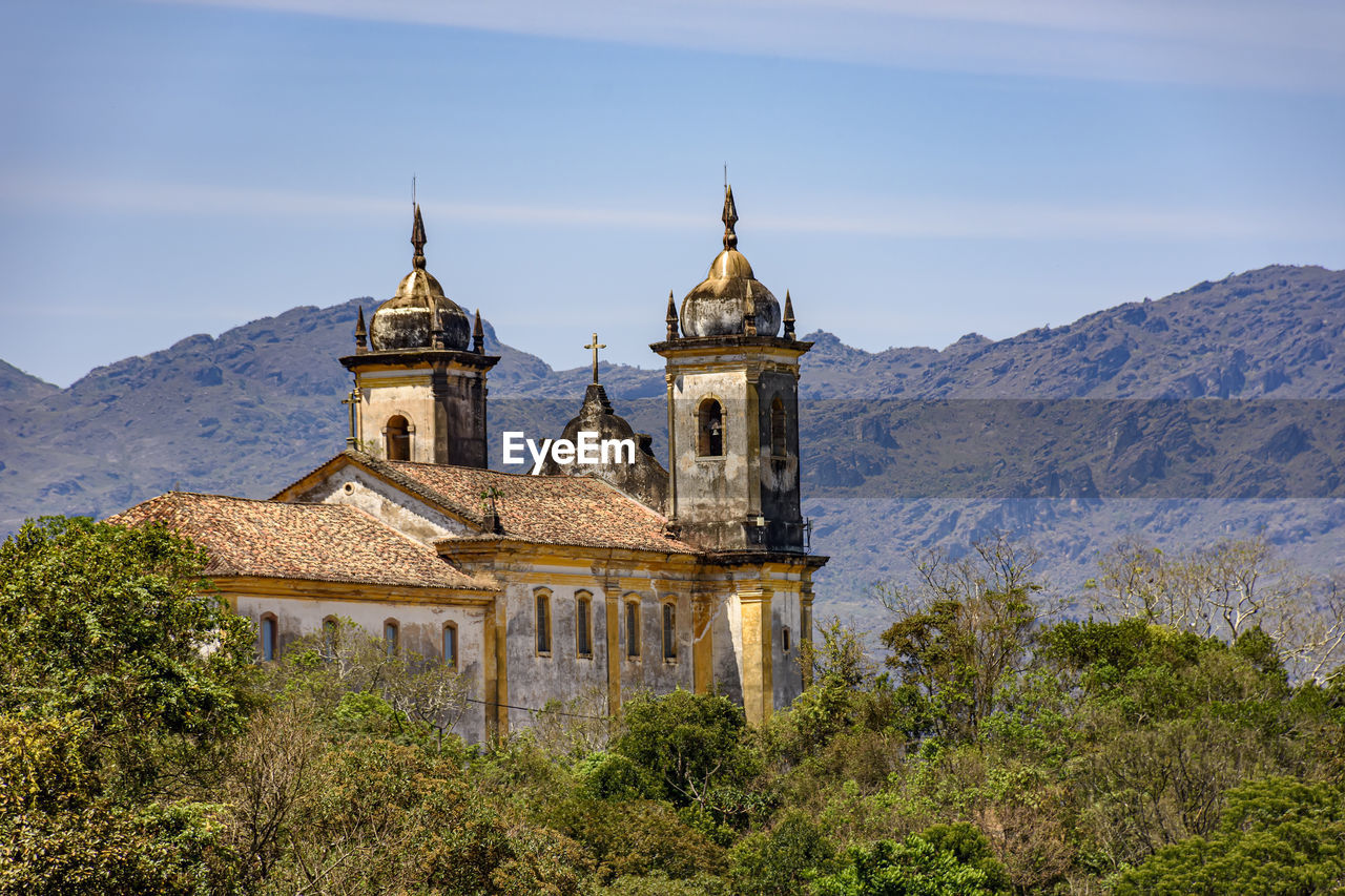 Old colonial-style church in the historic city of ouro preto in minas gerais and its mountains
