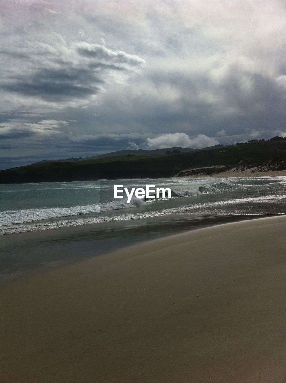 BEACH AGAINST SKY