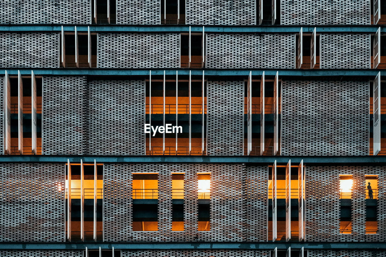 Full frame shot of a brick building at night