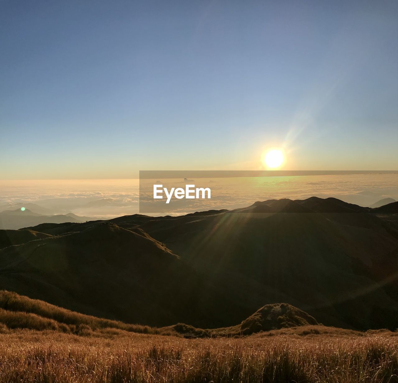 Scenic view of mountains against sky during sunset