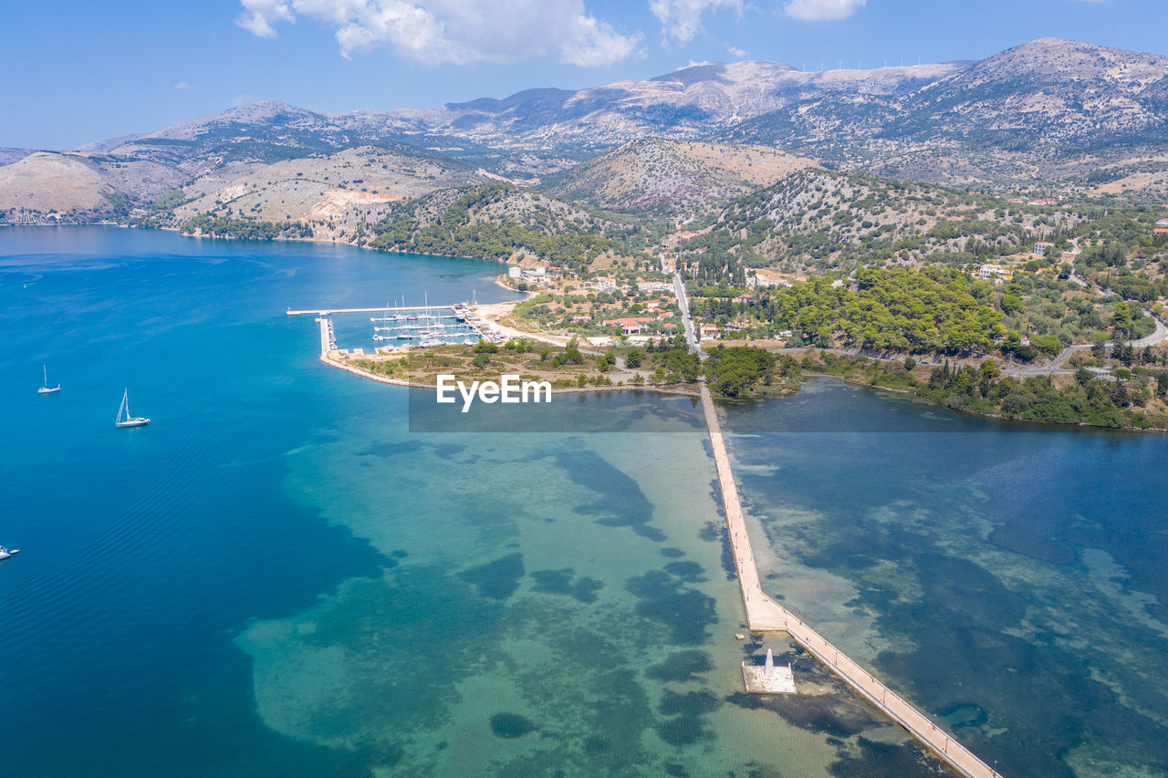 HIGH ANGLE VIEW OF CITY BY SEA