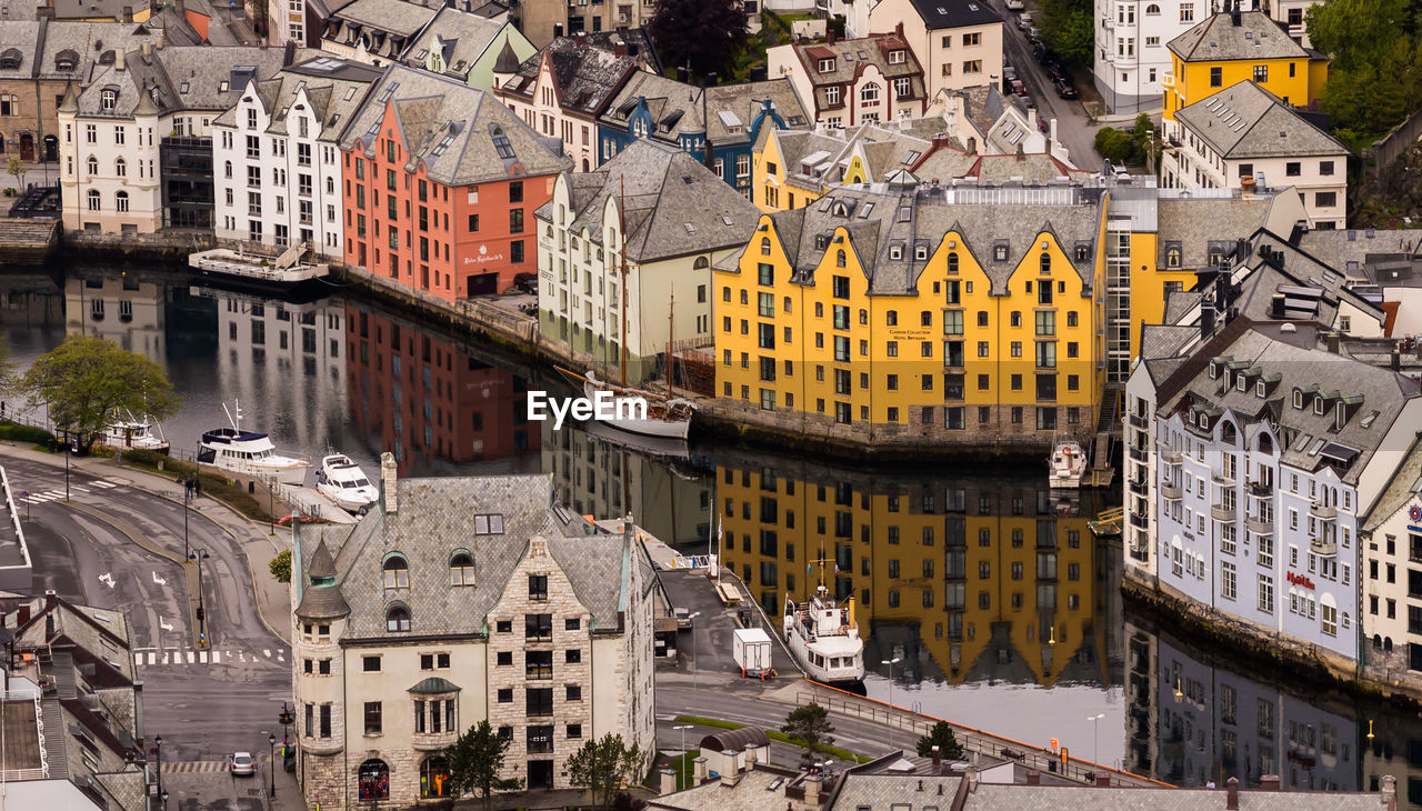 High angle view of river amidst buildings in city