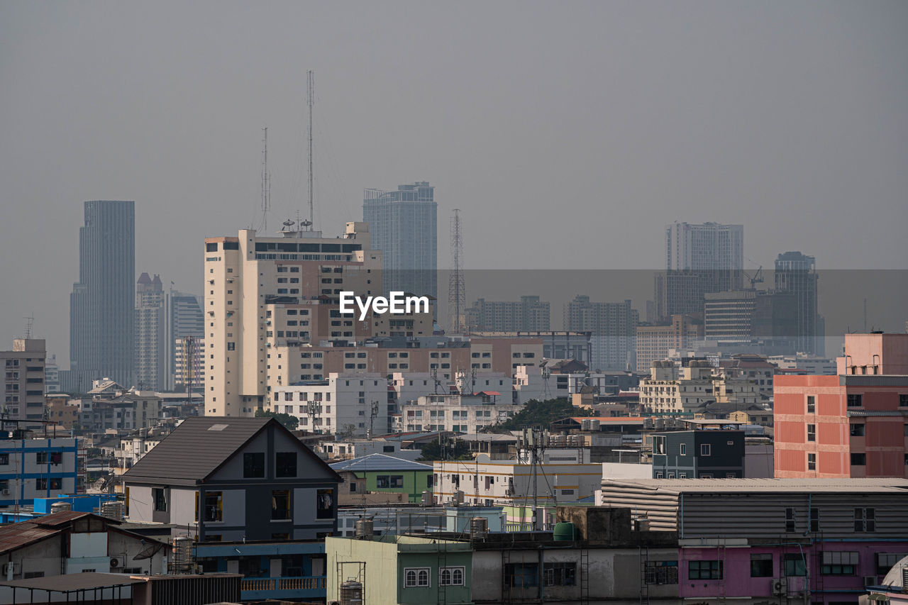 Buildings in city against sky