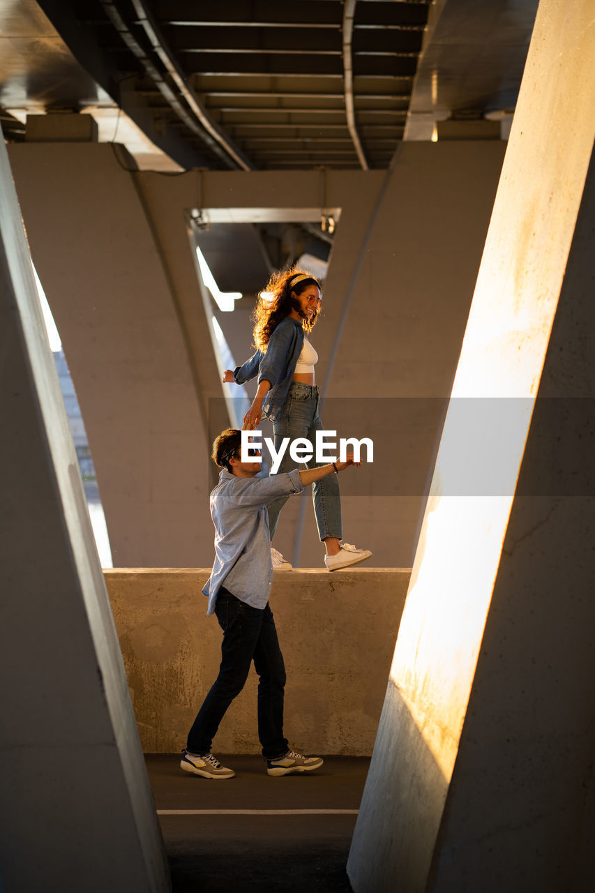 Low angle view of people walking on staircase