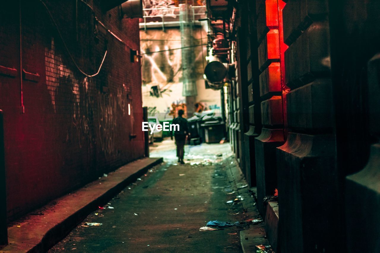 Man walking on road in city