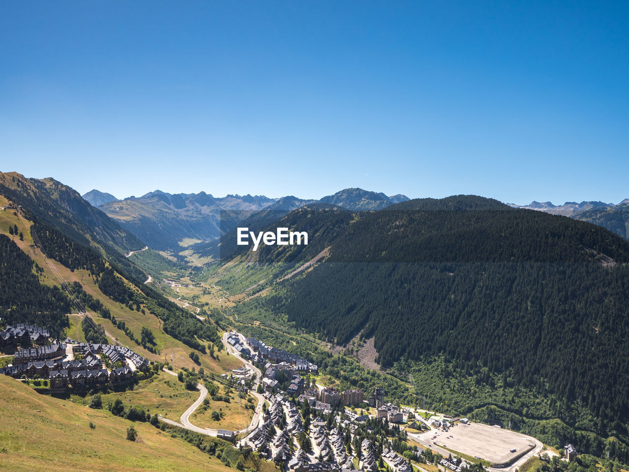PANORAMIC VIEW OF MOUNTAINS AGAINST CLEAR BLUE SKY