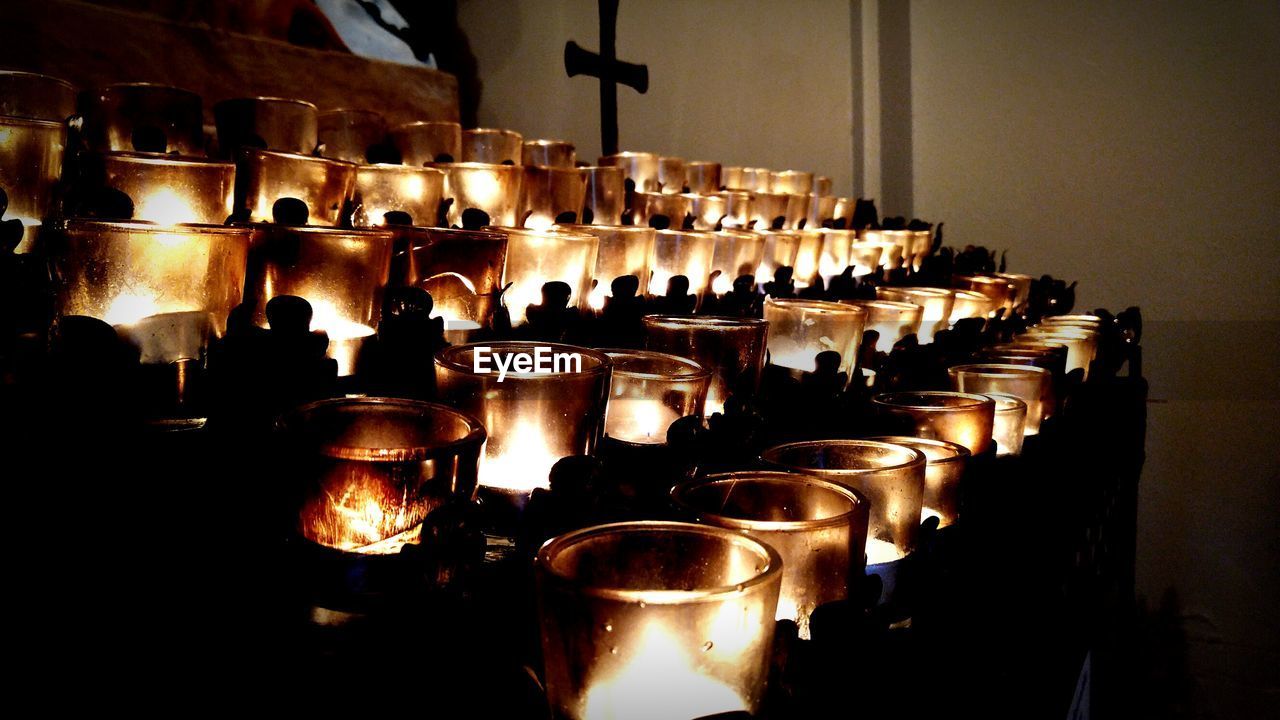 Close-up of illuminated tea light candles