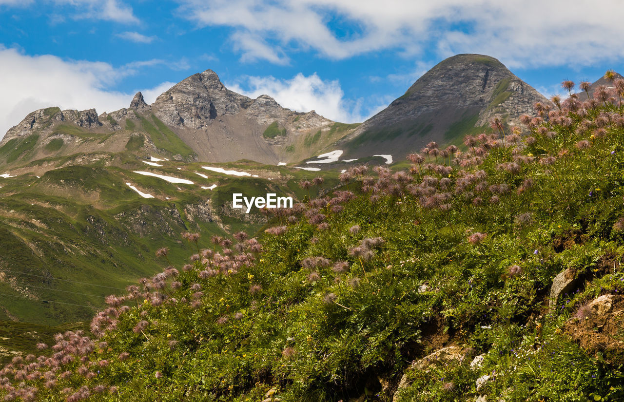 SCENIC VIEW OF MOUNTAINS AGAINST SKY DURING SUNRISE