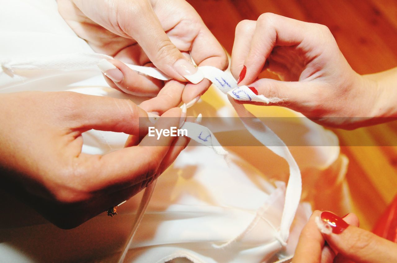 Cropped image of women with bride dress