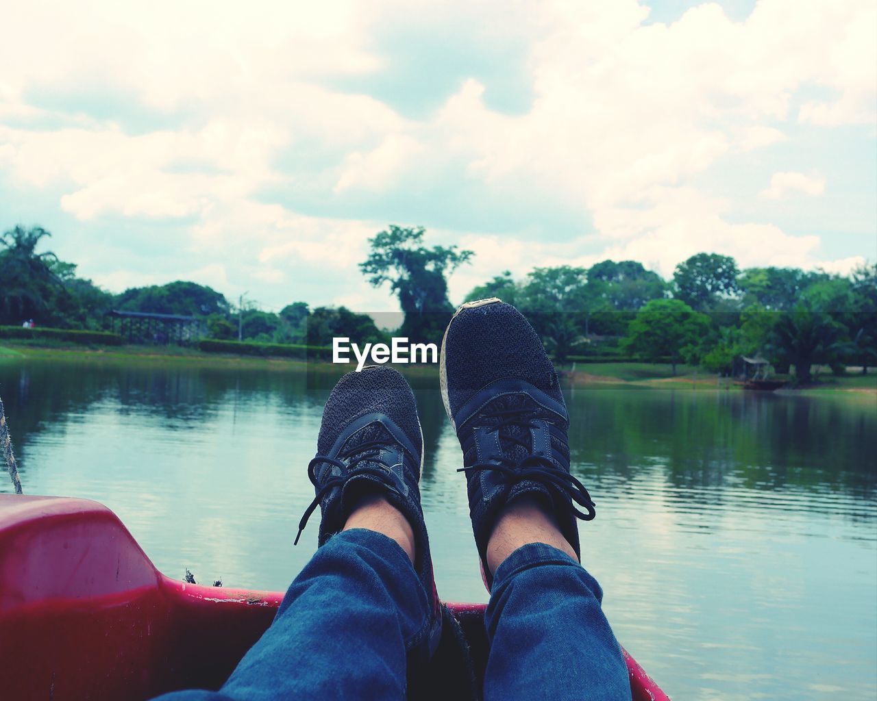 LOW SECTION OF MAN AGAINST LAKE AGAINST SKY