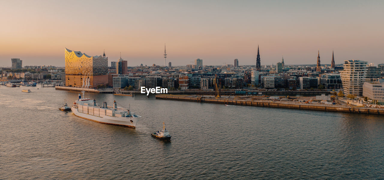 View of buildings at waterfront in hamburg germany 