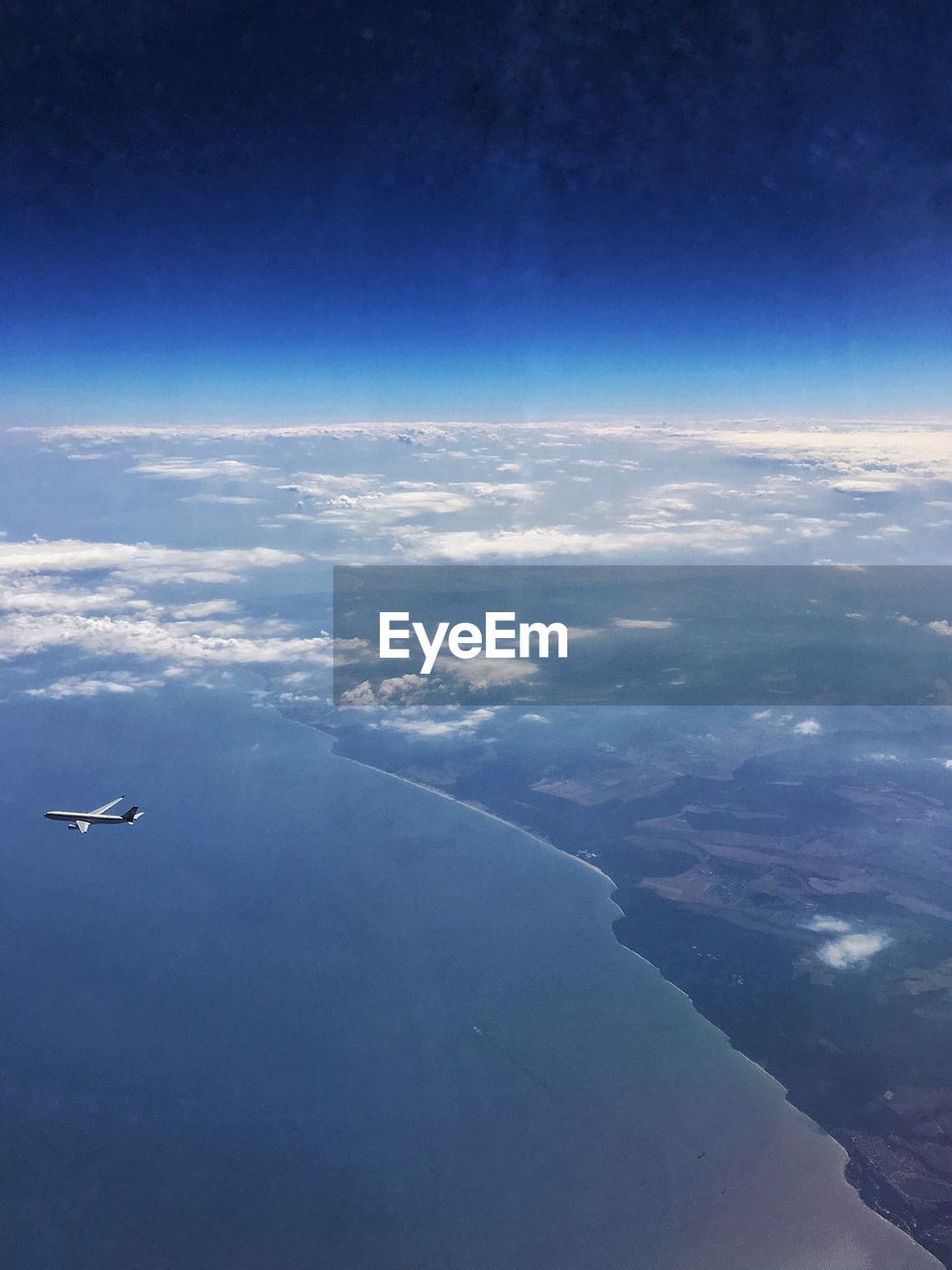 Aerial view of landscape by sea