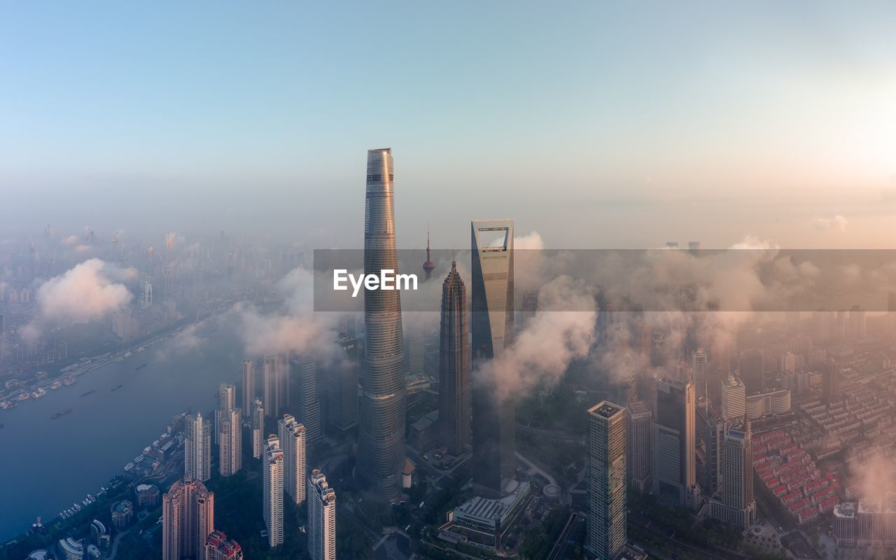 HIGH ANGLE VIEW OF BUILDINGS AGAINST SKY