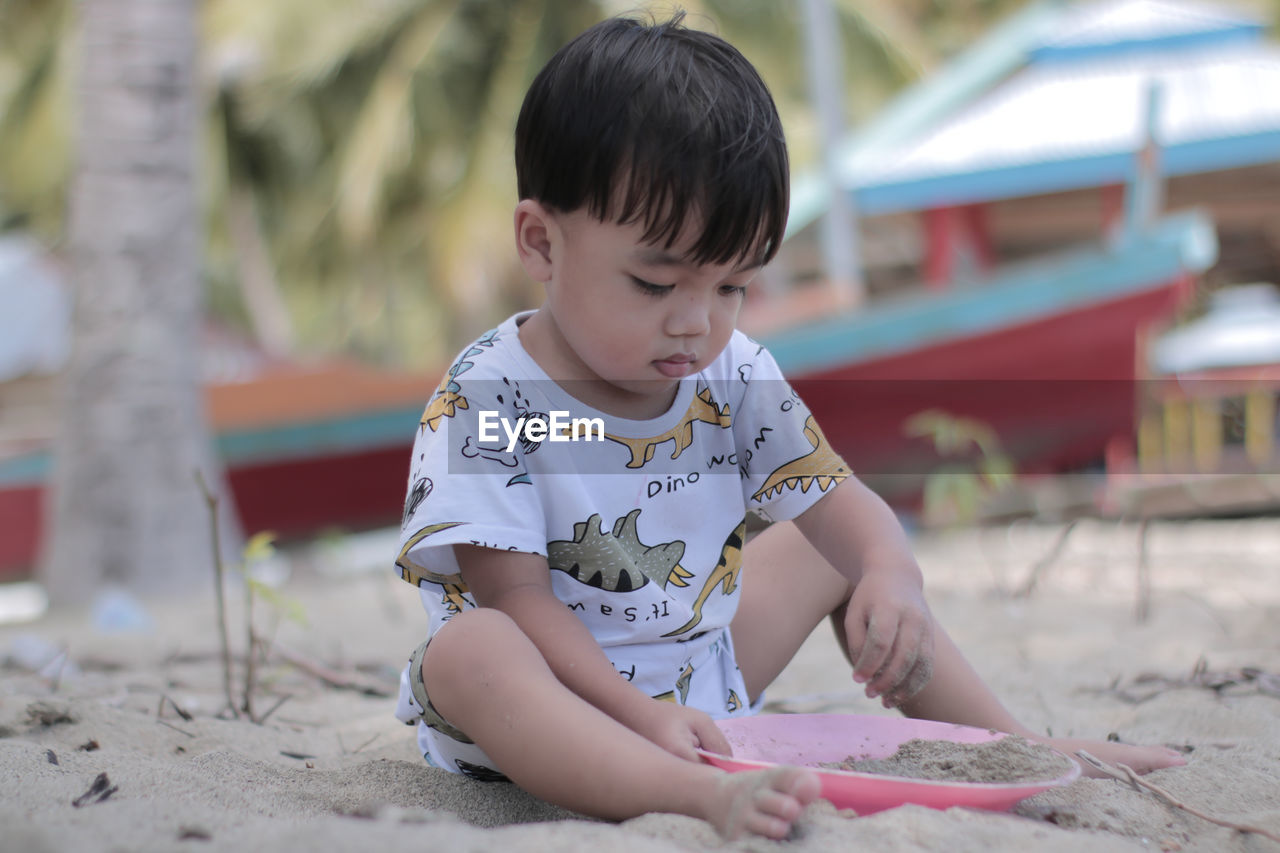 Close-up of cute boy looking away