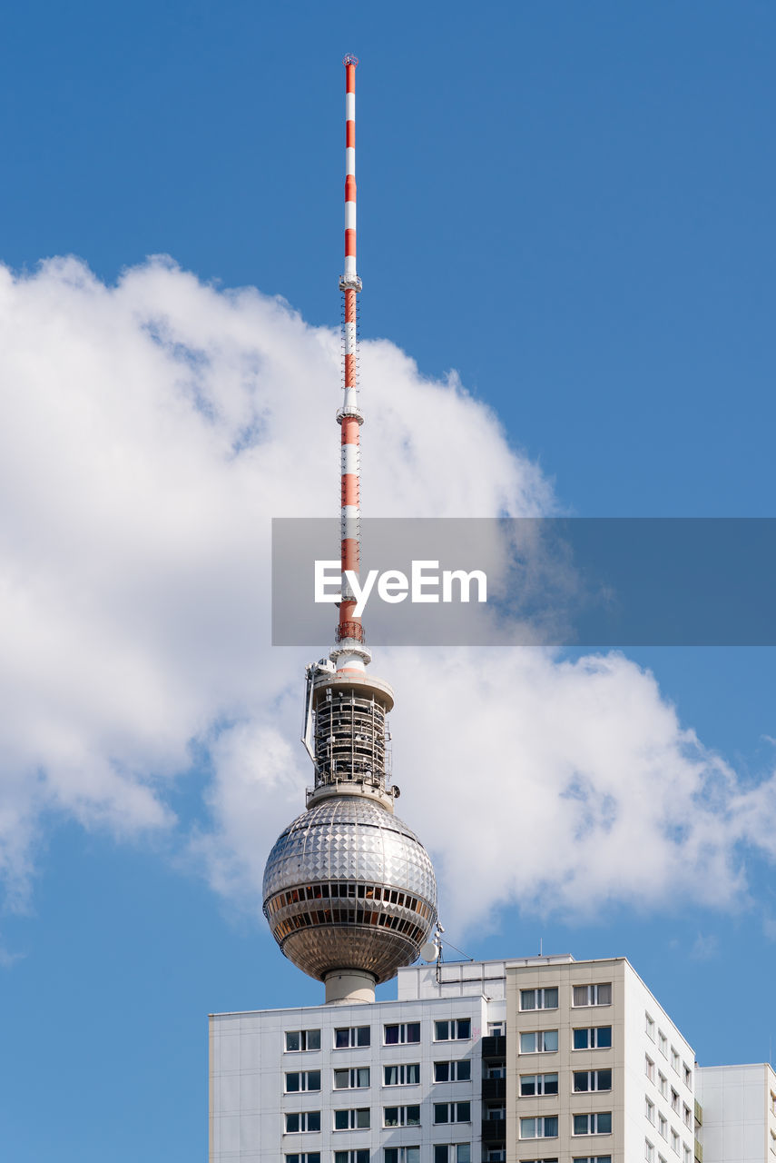 Cityscape of berlin with skyscraper and tv tower against blue sky with clouds