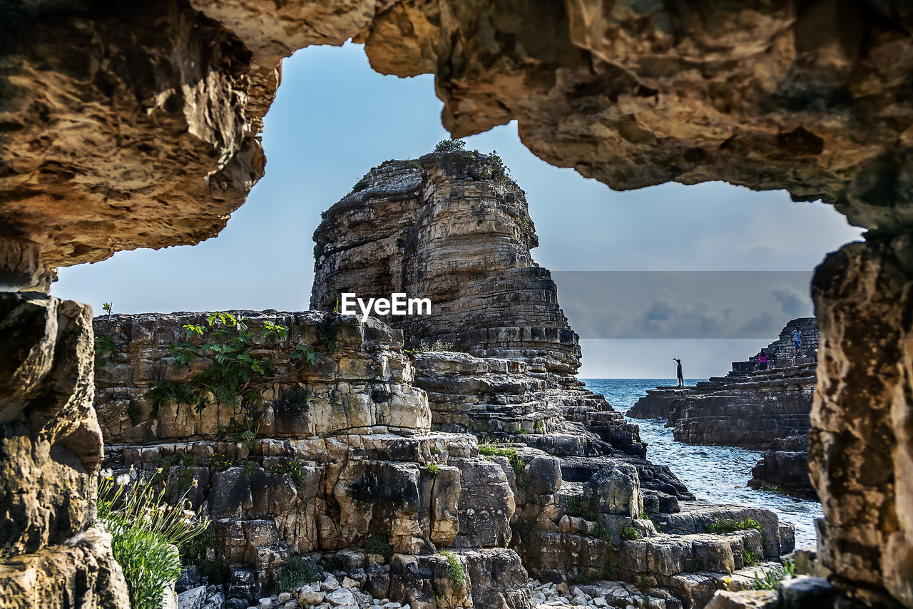 LOW ANGLE VIEW OF ROCK FORMATIONS