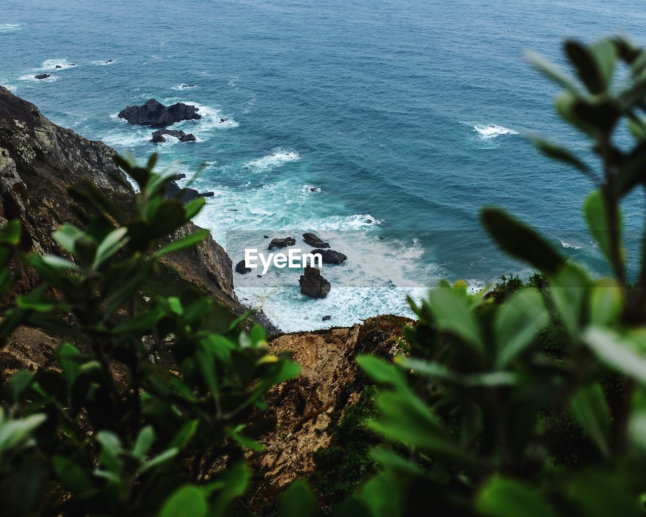 High angle view of rocks by sea