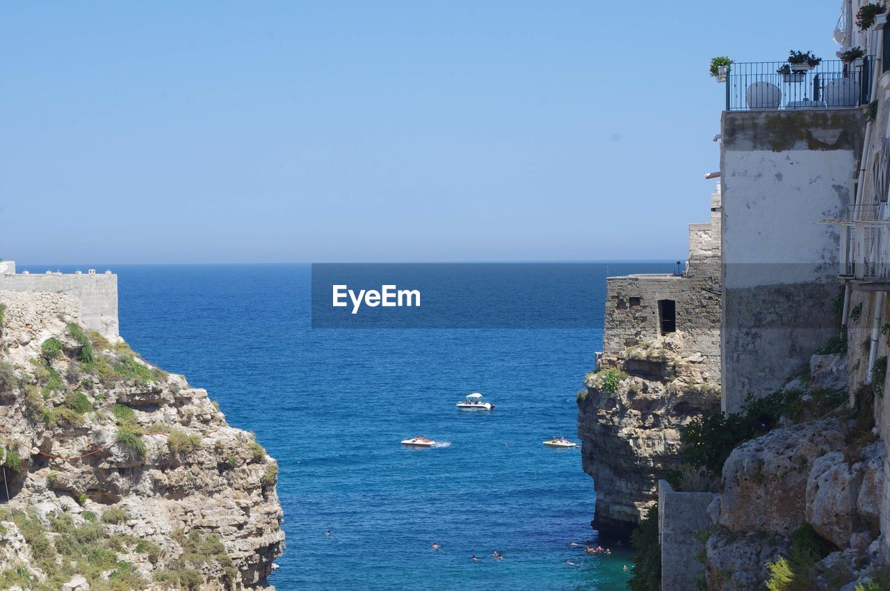 Scenic view of sea against clear blue sky