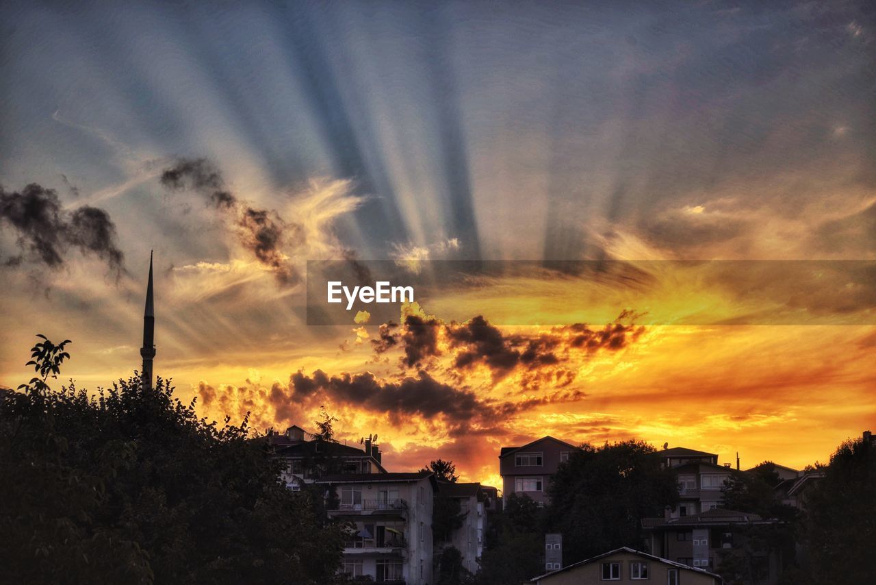 Dramatic sky over city during sunset