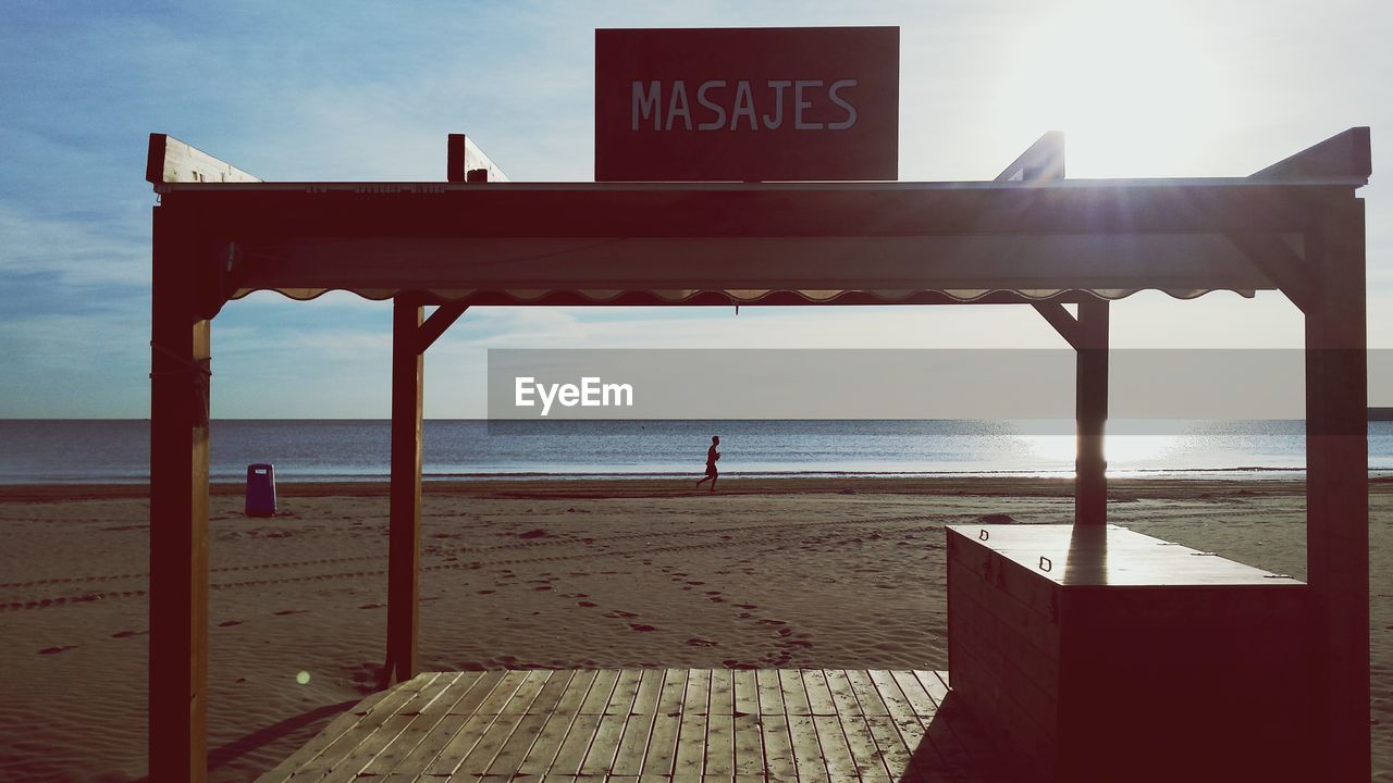 Wooden structure on beach during sunny day