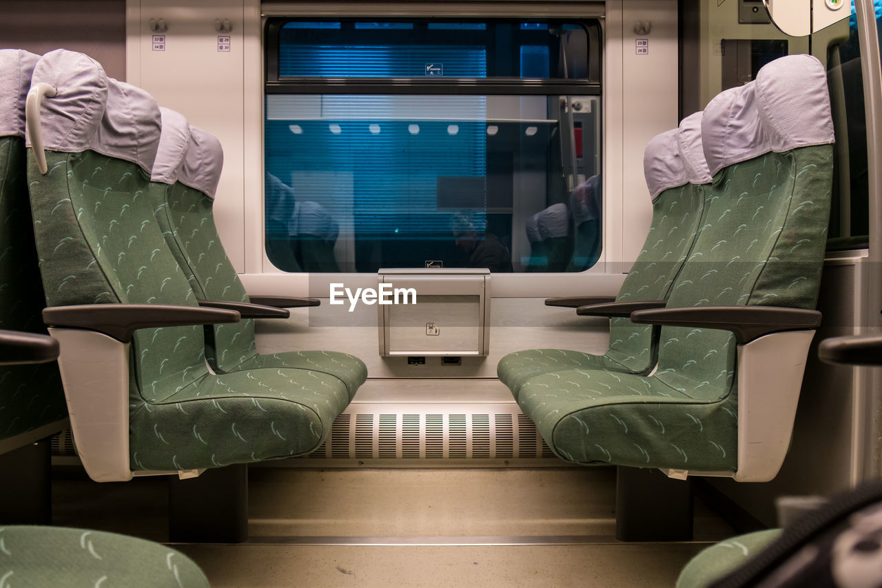 Empty green seats in train