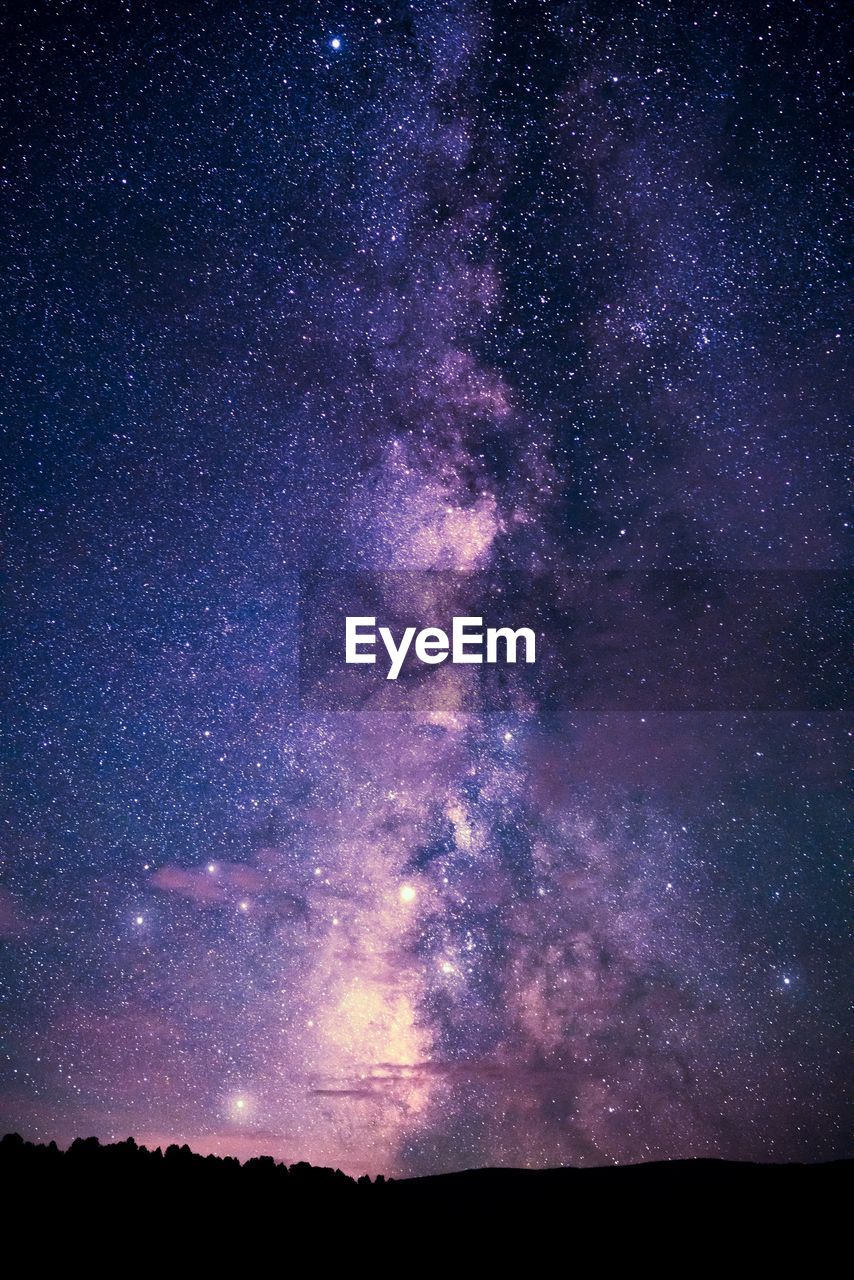 Scenic view of galaxy in sky at night