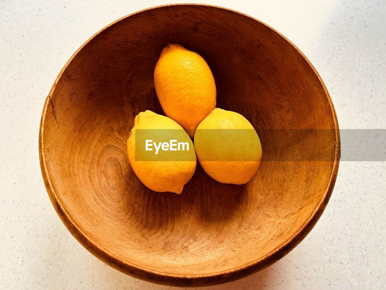 food, food and drink, healthy eating, freshness, wellbeing, produce, fruit, indoors, no people, still life, plant, citrus fruit, citrus, wood, directly above, bowl, studio shot, orange, table, orange color, close-up, high angle view, yellow