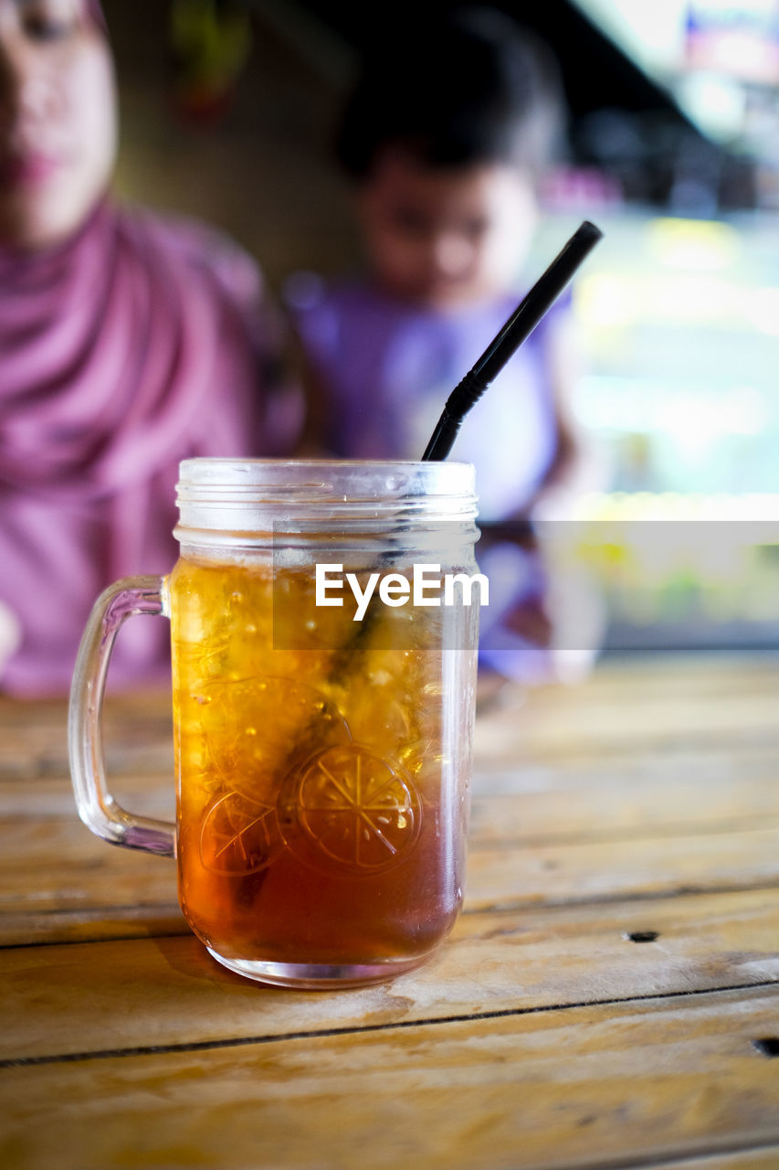 CLOSE-UP OF DRINK ON TABLE