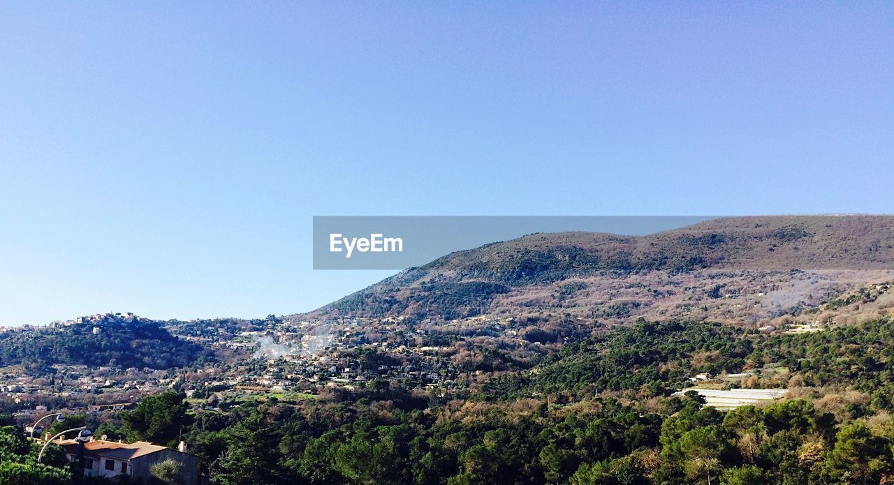 SCENIC VIEW OF MOUNTAINS AGAINST CLEAR SKY