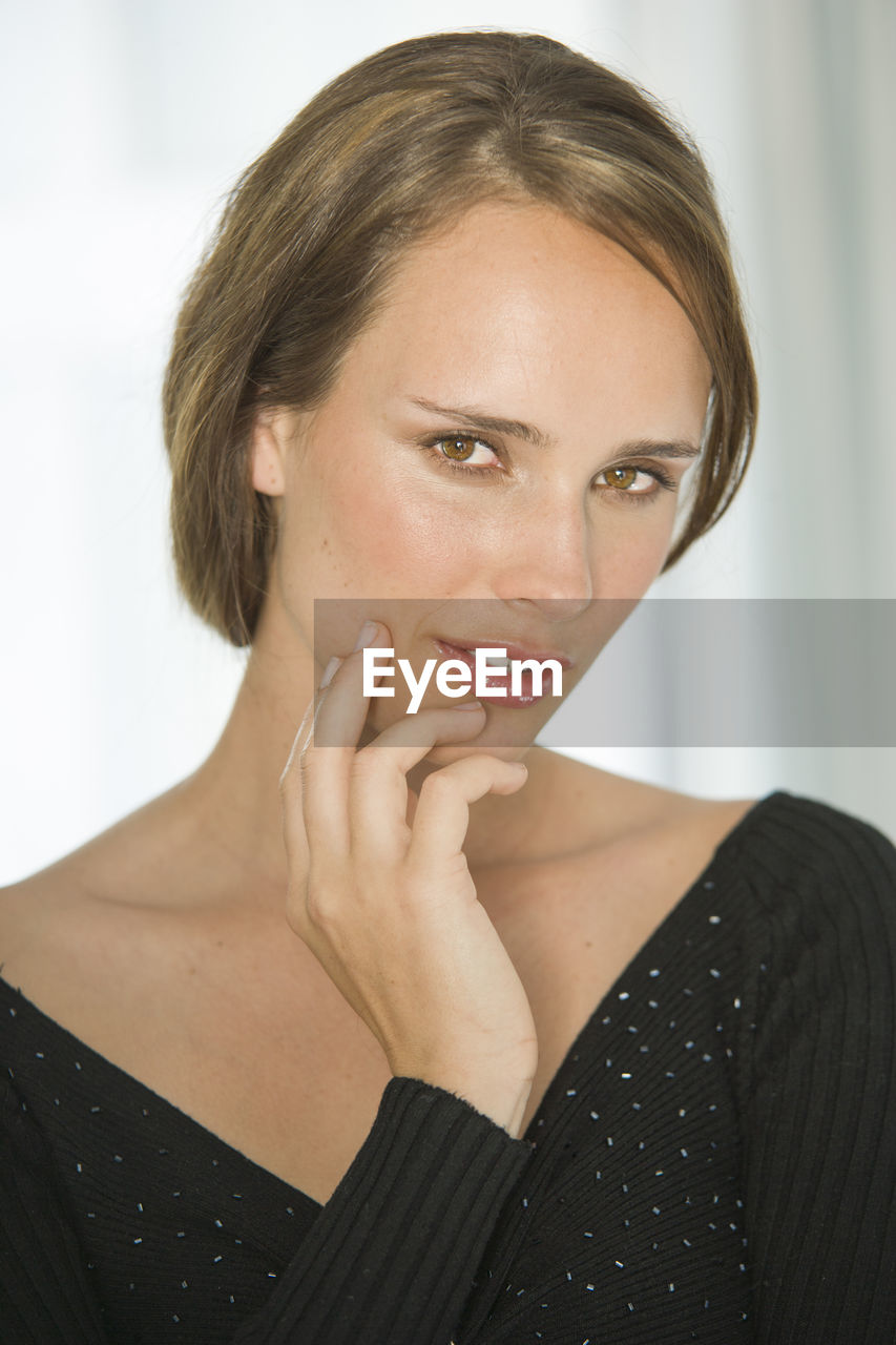 Close-up portrait of beautiful woman with short hair