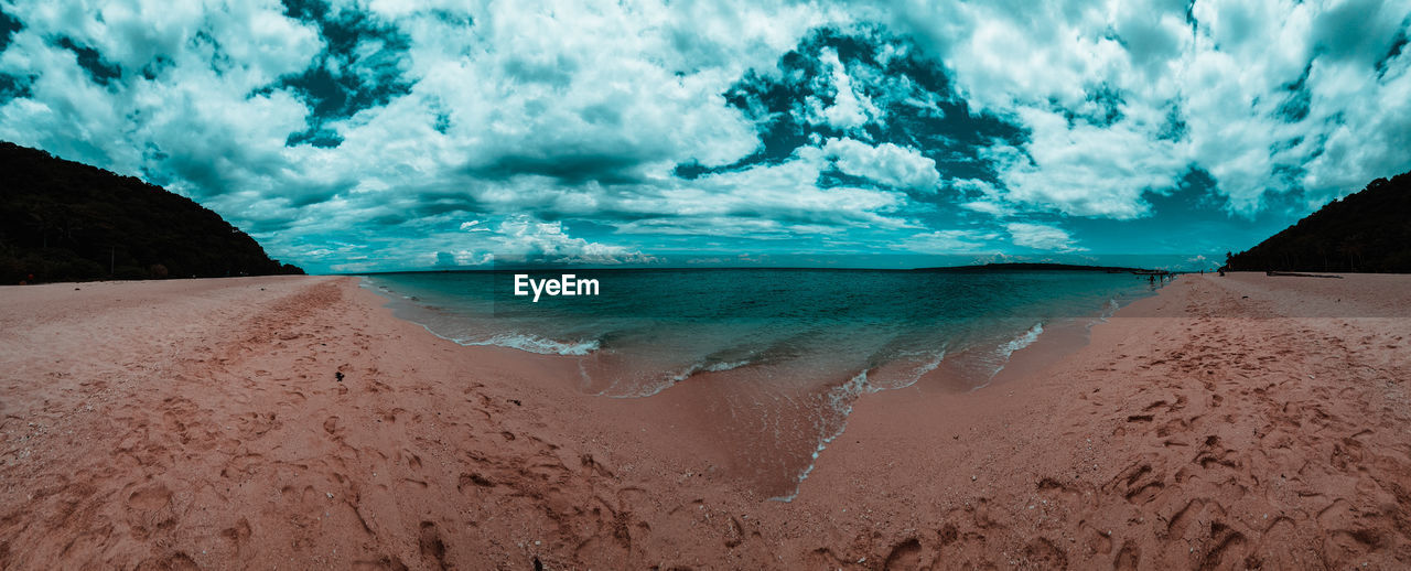 Panoramic view of beach against sky