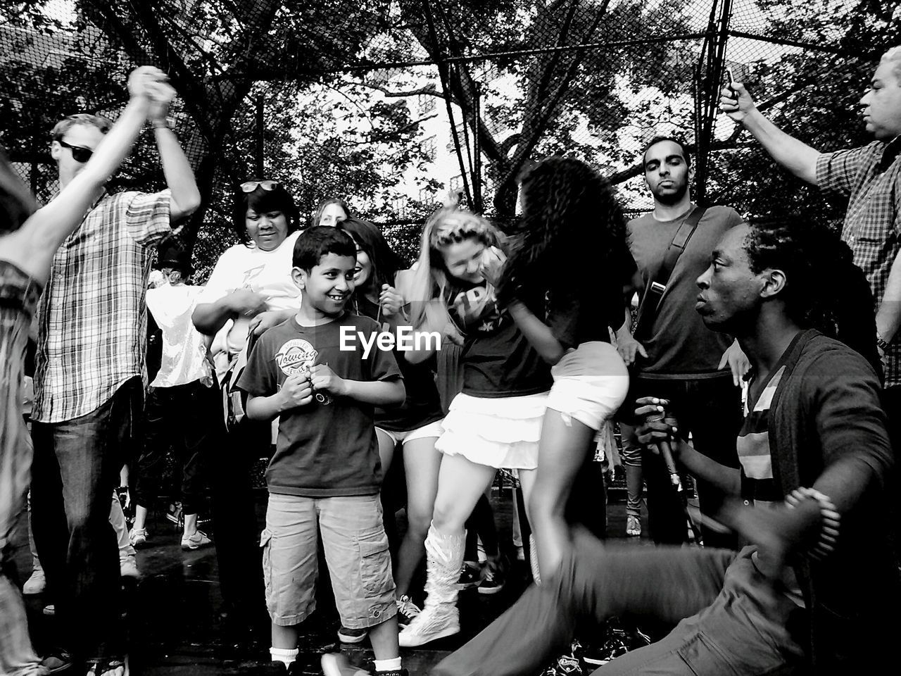 BOY PLAYING WITH ARMS RAISED AT HOME