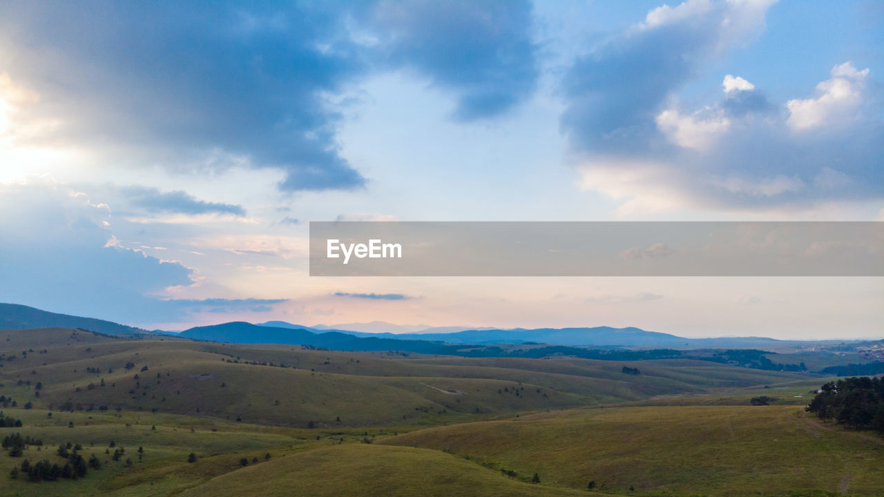 Scenic view of landscape against sky during sunset