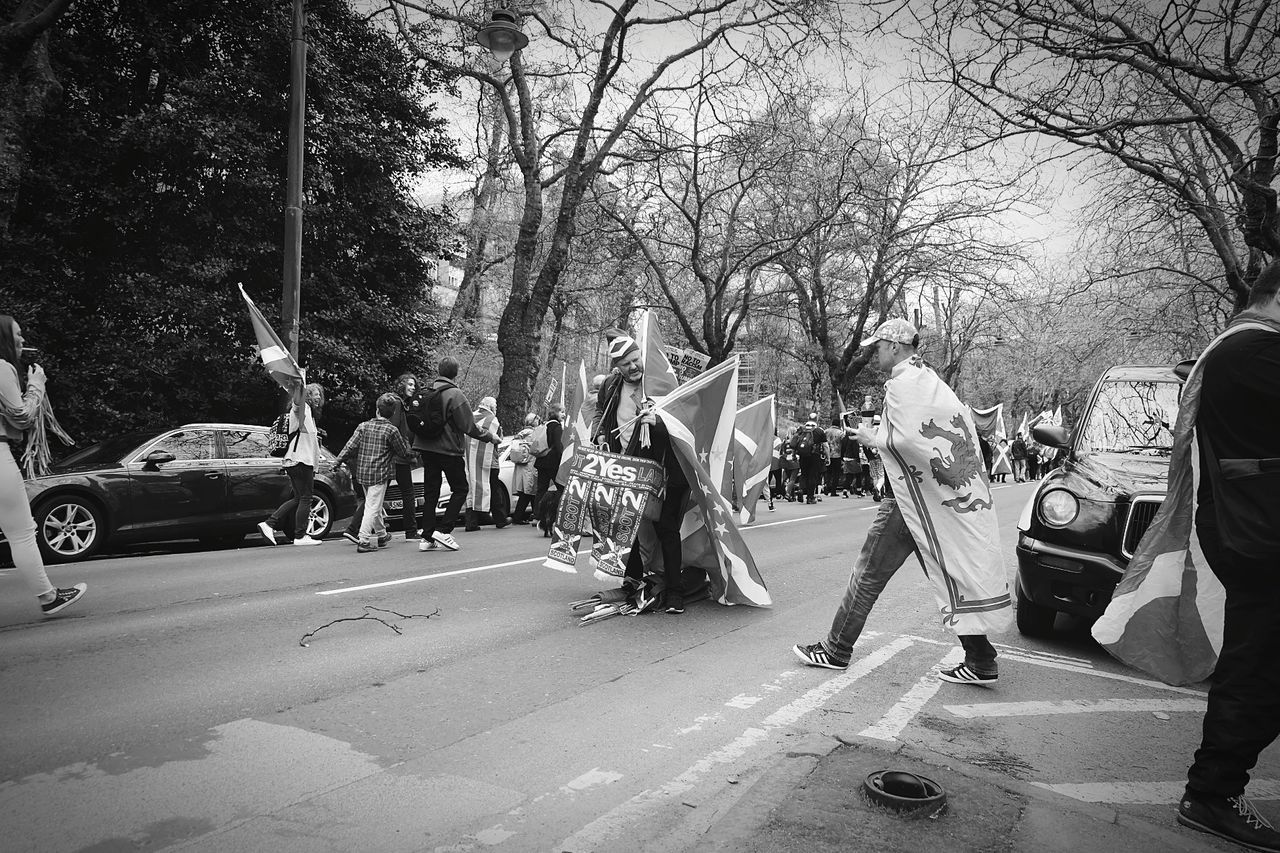 GROUP OF PEOPLE ON STREET